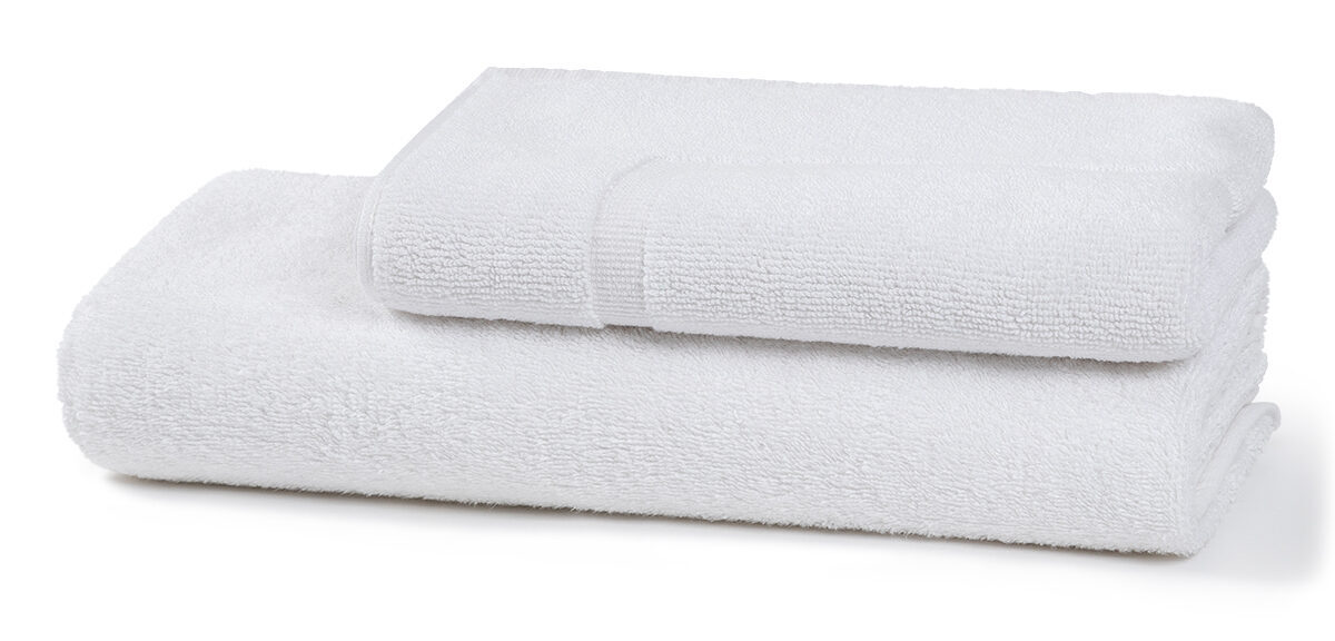 Cotton bath towel and hand towel set folded on white background